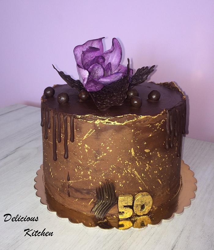 Chocolate cake with wafer paper magnolia