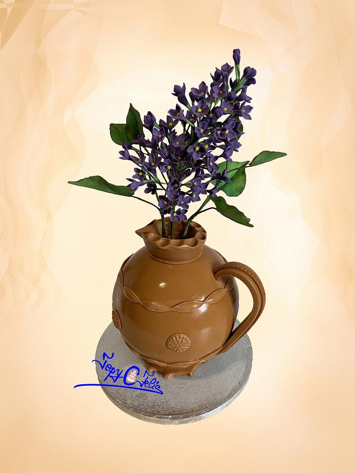Romanian traditional pottery with lilac flower 