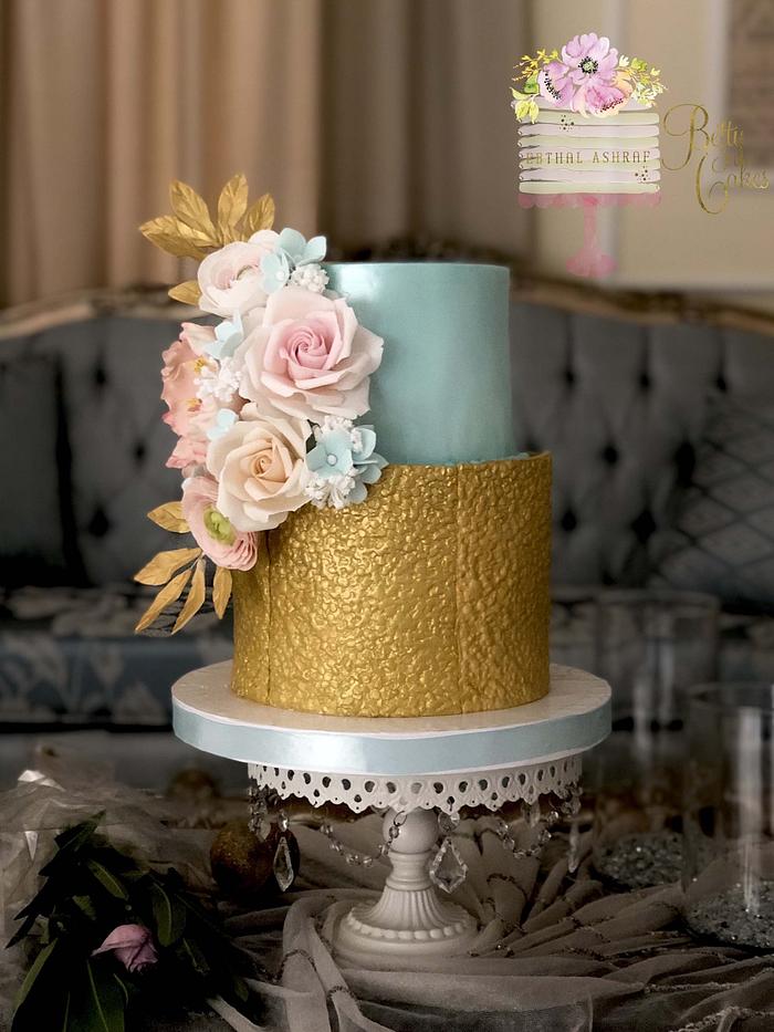 Blue and gold wedding cake 