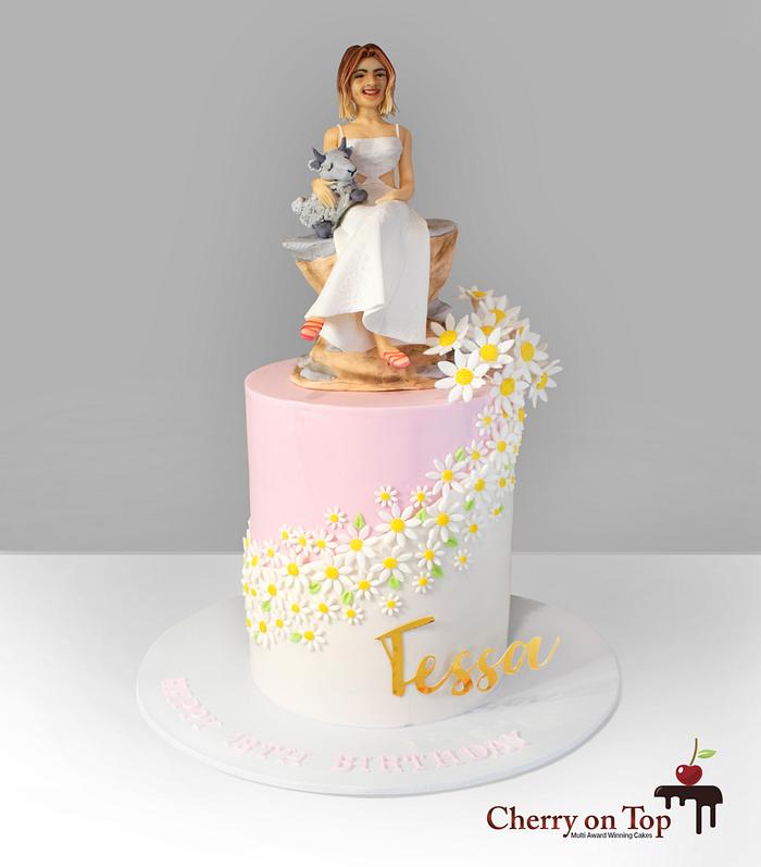 Daisy cake and handcrafted figurine