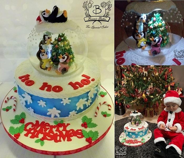 Snow globe Christmas cake with penguins