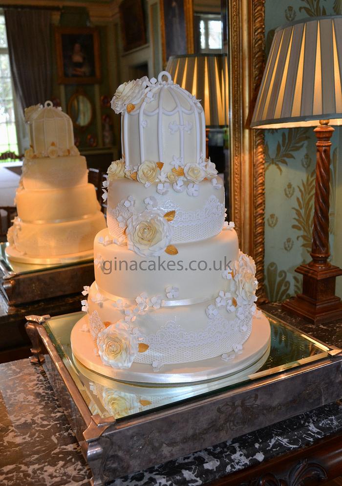 4 tier ivory & gold rose wedding cake