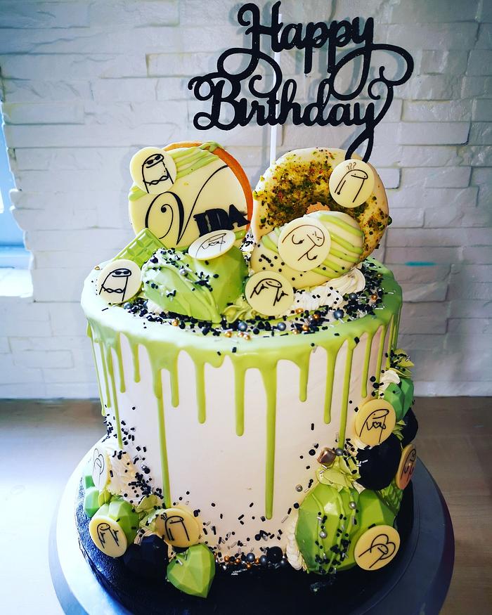 Green white drip cake with sweets 