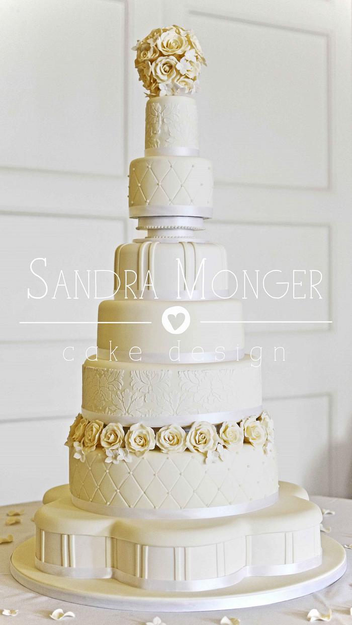 7 tier ivory and white wedding cake.