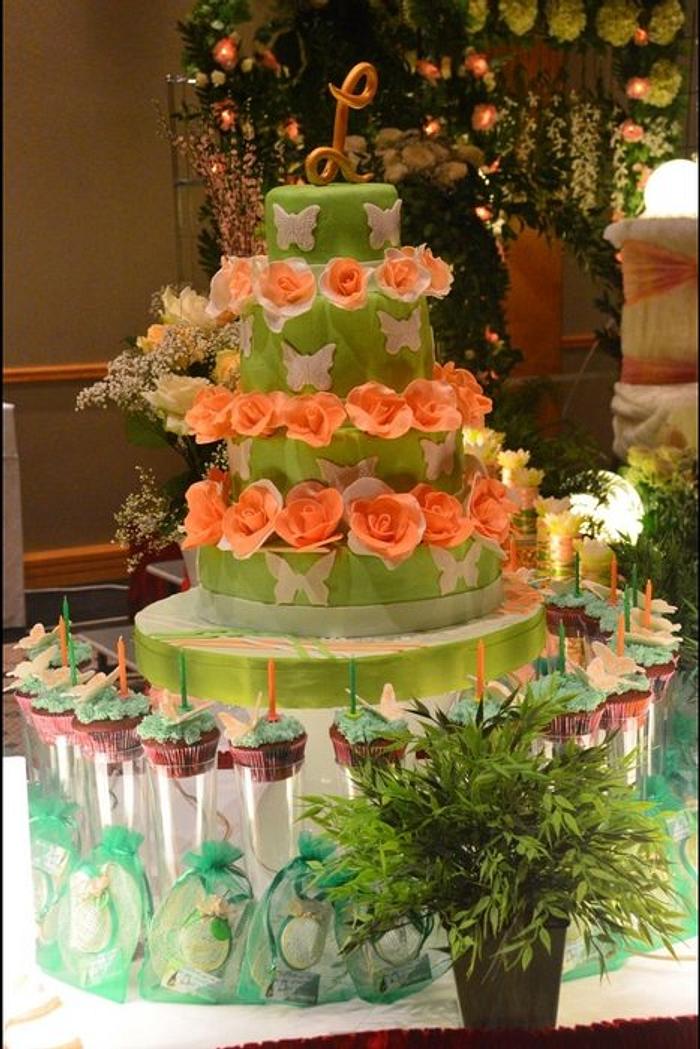 green cake with peach roses