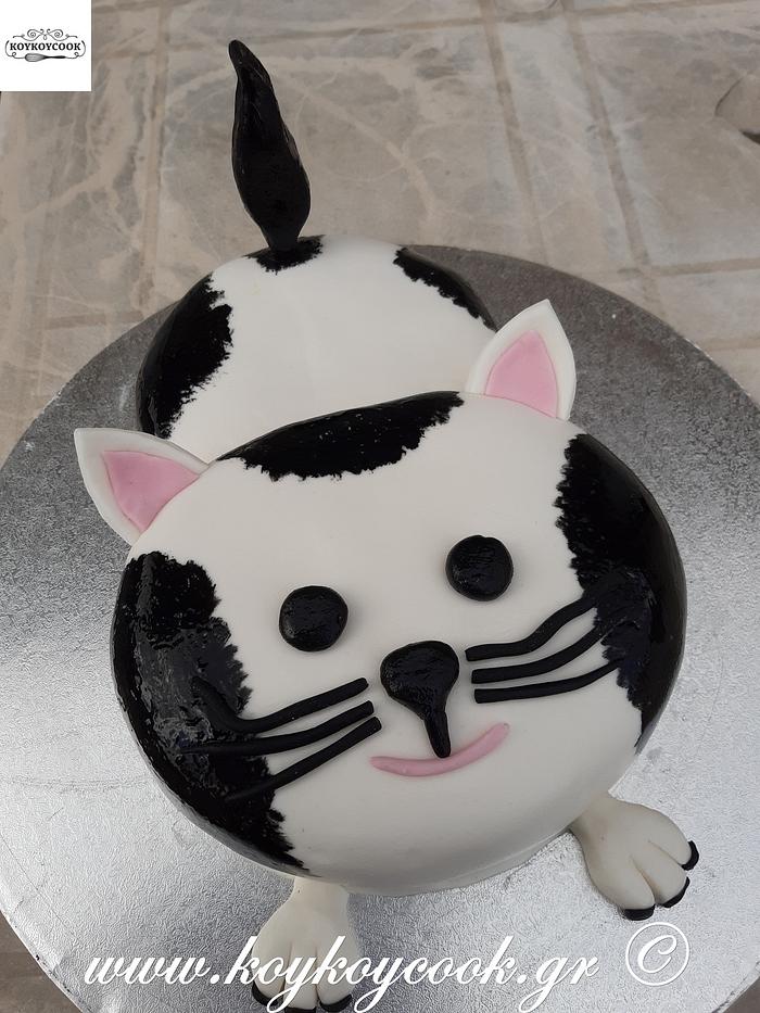 Whimsical Delight: Artistic White and Blue Cat-Shaped Cake in Coconut  Shell