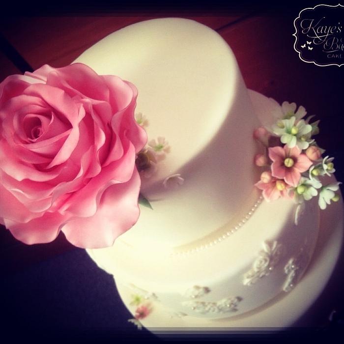 Lace and pearl wedding cake