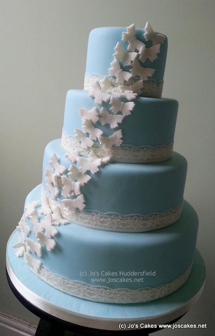 Wedgwood Blue 4 Tier Wedding Cake with Ivory Butterflies
