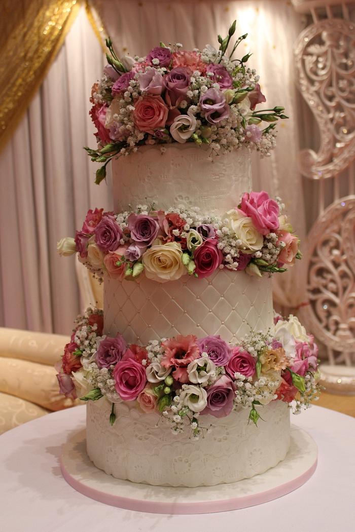 Lace and fresh flower wedding cake