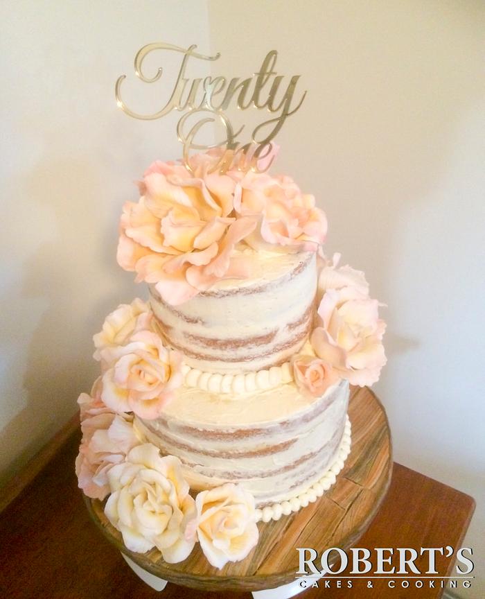 Naked cake with peonies and roses