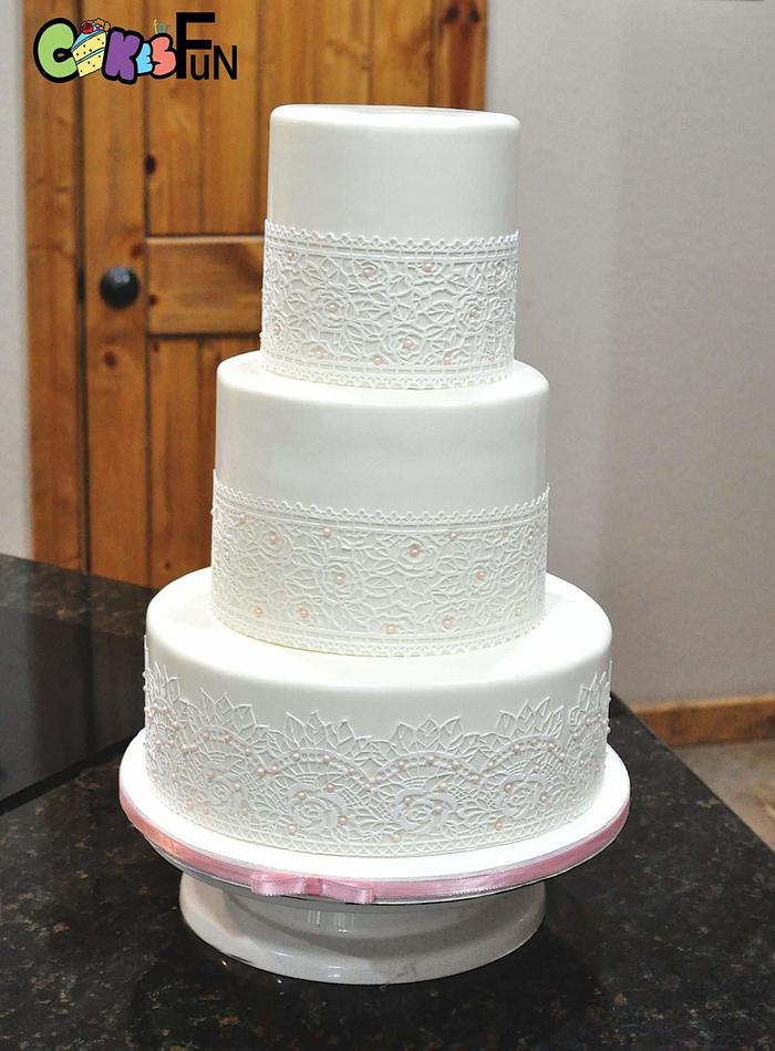 White wedding cake with cake lace