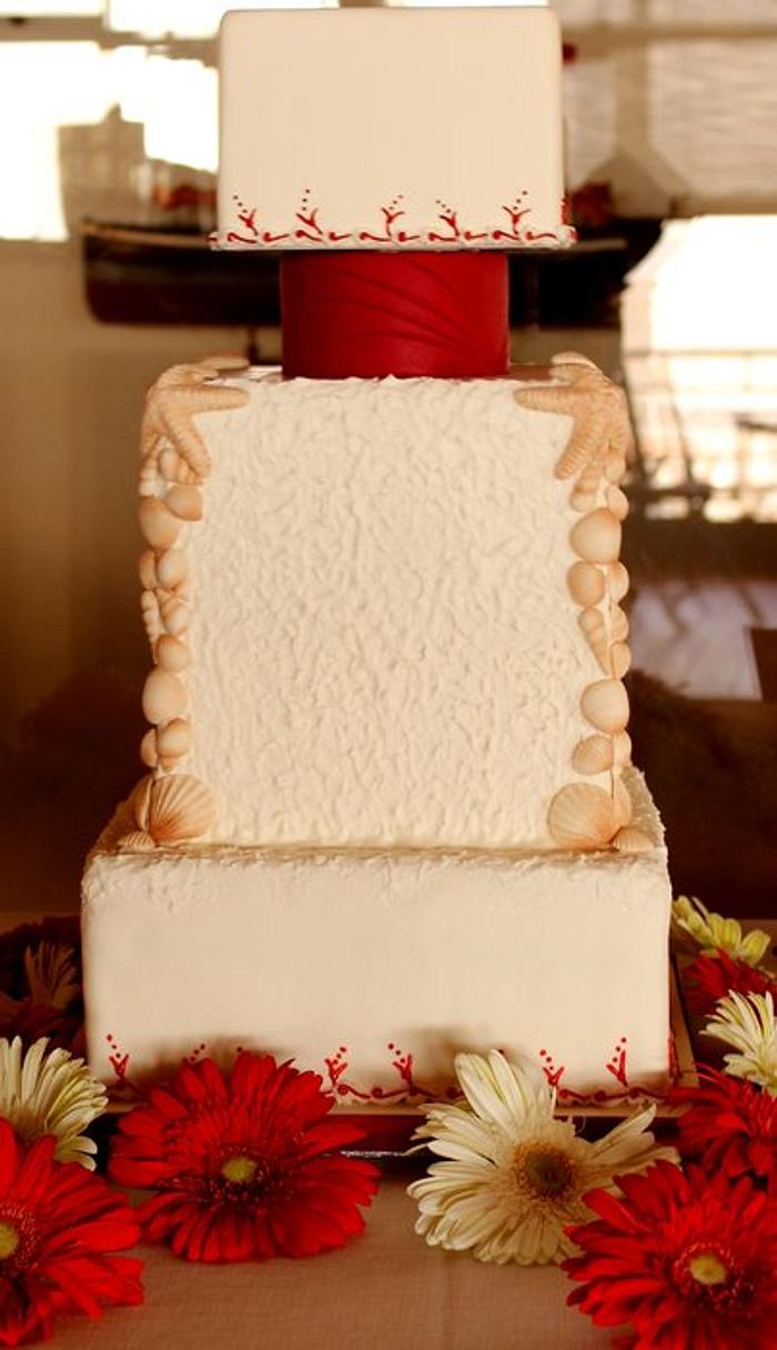 Red and white beach wedding cake