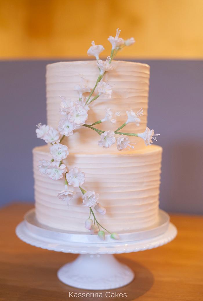 Buttercream 2 tier wedding cake with cherry blossoms