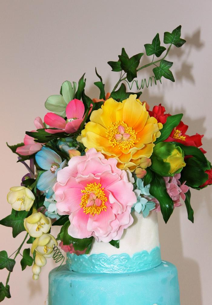 Turquoise wedding cake with flowers