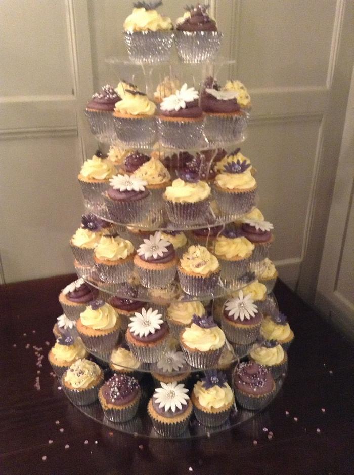 Purple and cream wedding cupcakes.