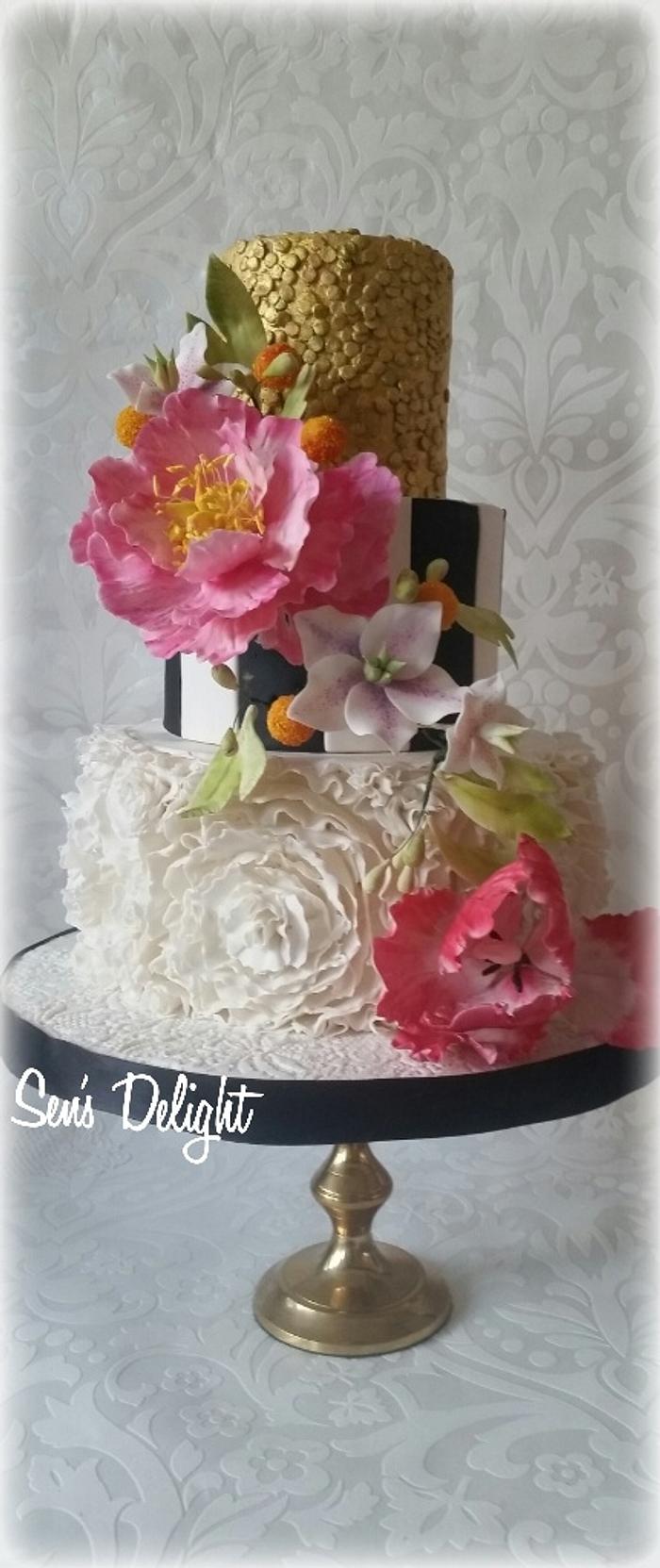 Wedding cake with a large peony and parrot tulip