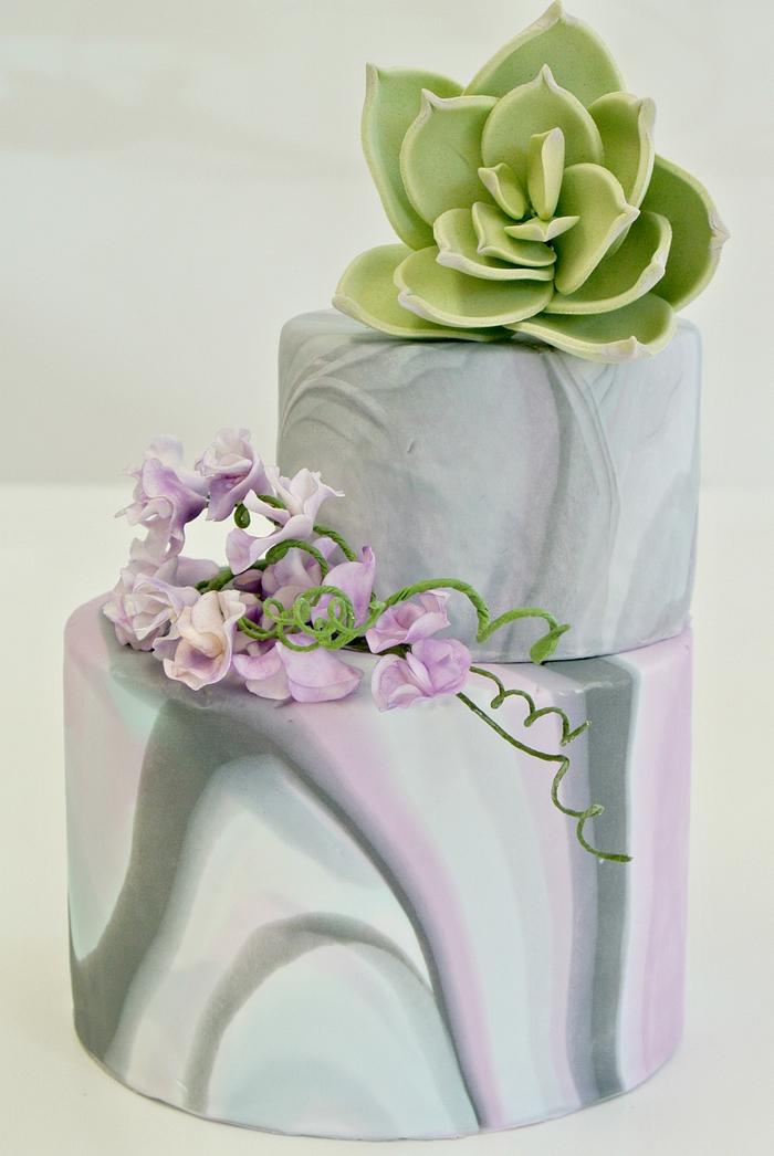 Cake with marble effect, sweet peas and succulents