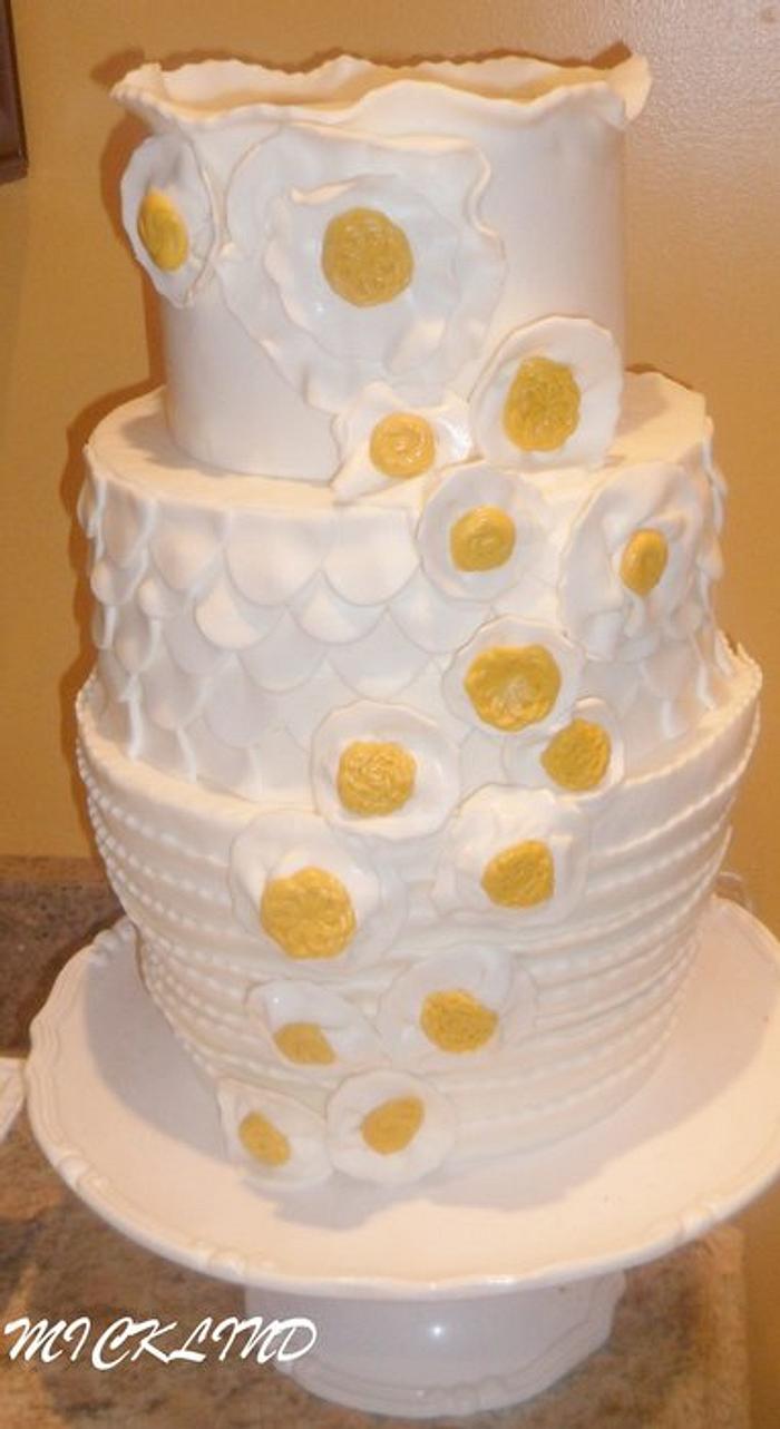A WHITE AND MUSTARD WEDDING CAKE