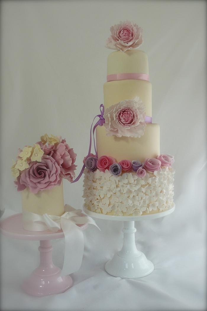 a summer garden wedding cake with wafer flowers