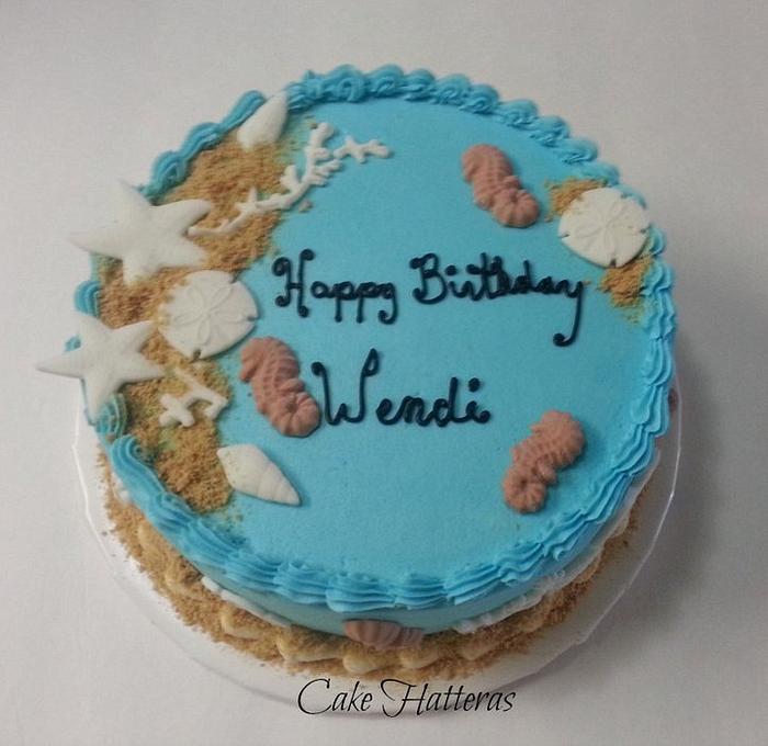 A Beach Birthday Cake with seahorses