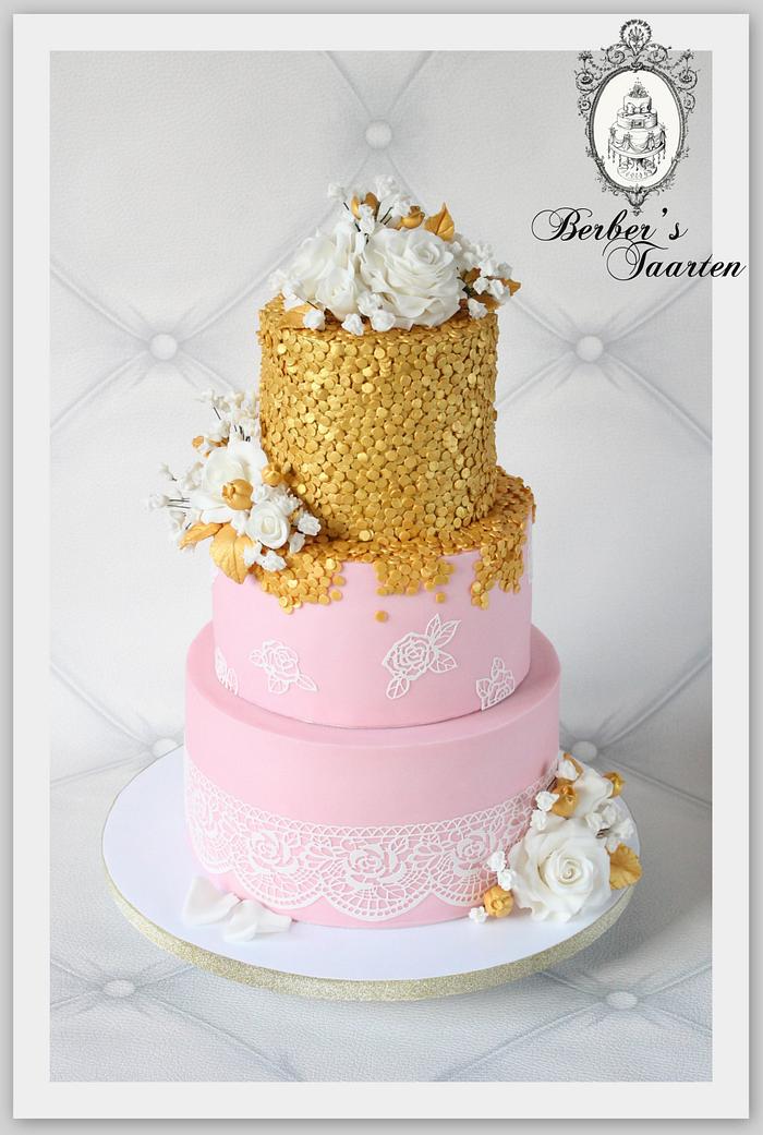 Pink cake with golden sequences. 