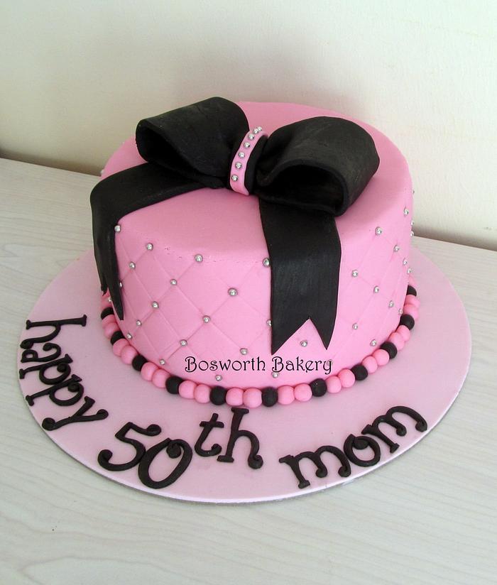 Diamond patterned cake with a bow