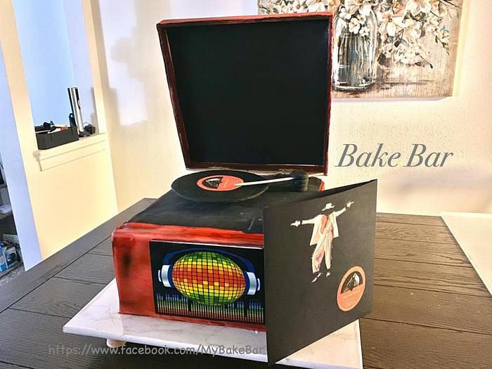 Spinning record player cake with light and sound
