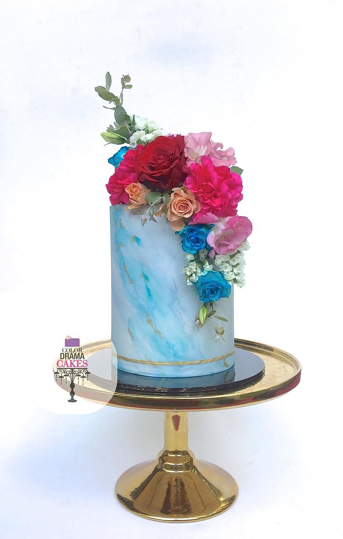 Blue marble cake with fresh flowers