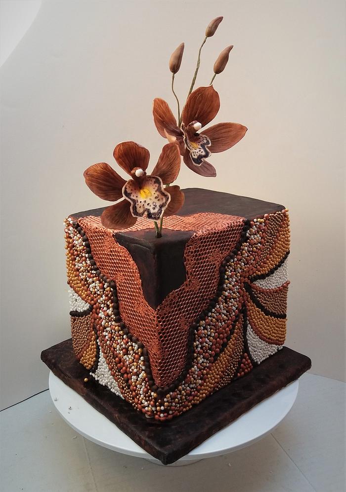 Beaded cake with chocolate cymbidium orchids