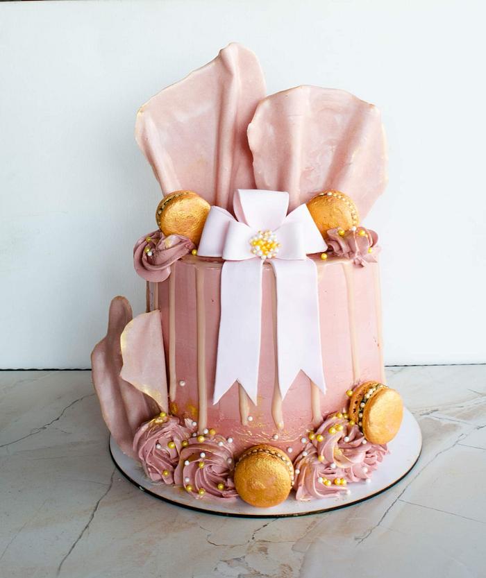 Cake with ribbon and chocolate waves