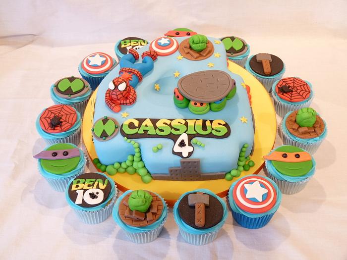 NUMBER FOUR SHAPED SUPER HEROES CAKE WITH MATCHING CUPCAKES