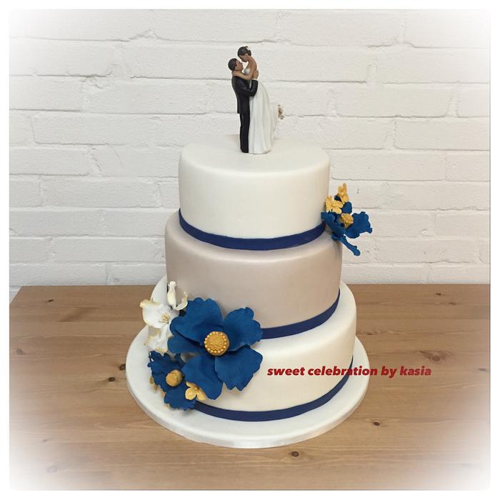 Wedding cake with blue flowers