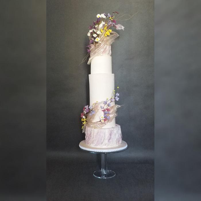 Wedding cake with meadow flowers 