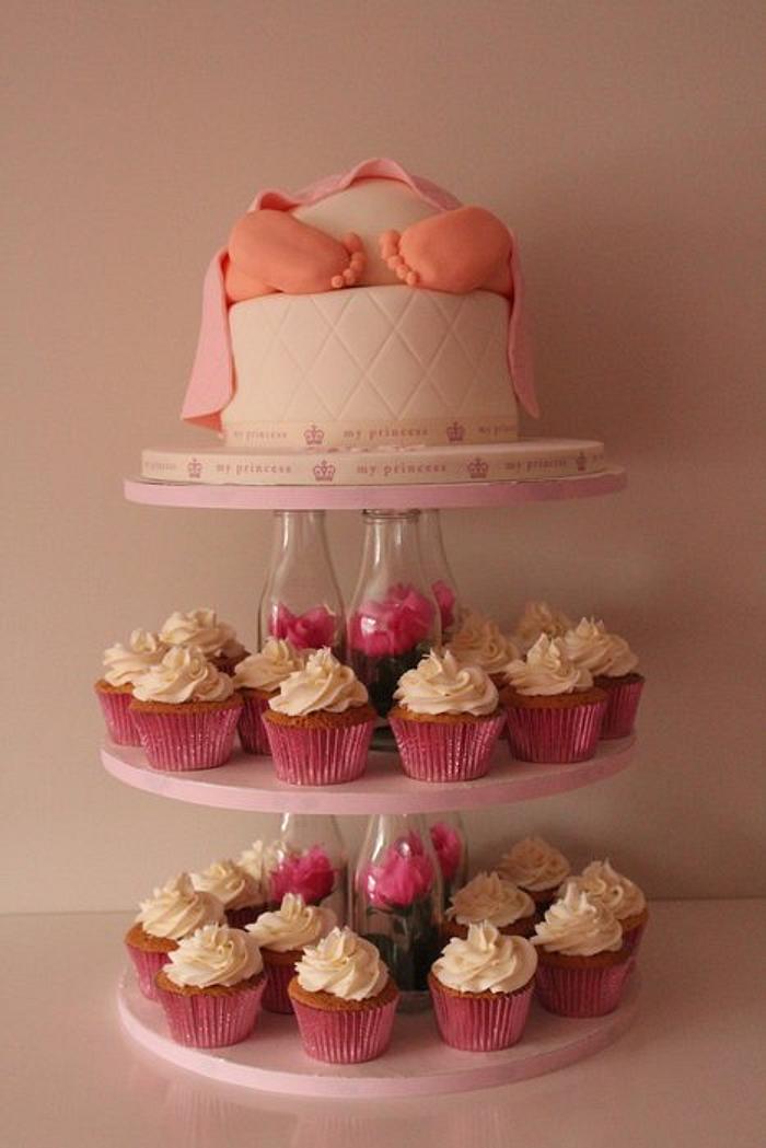Baby rump cake with cupcakes on a bespoke stand 