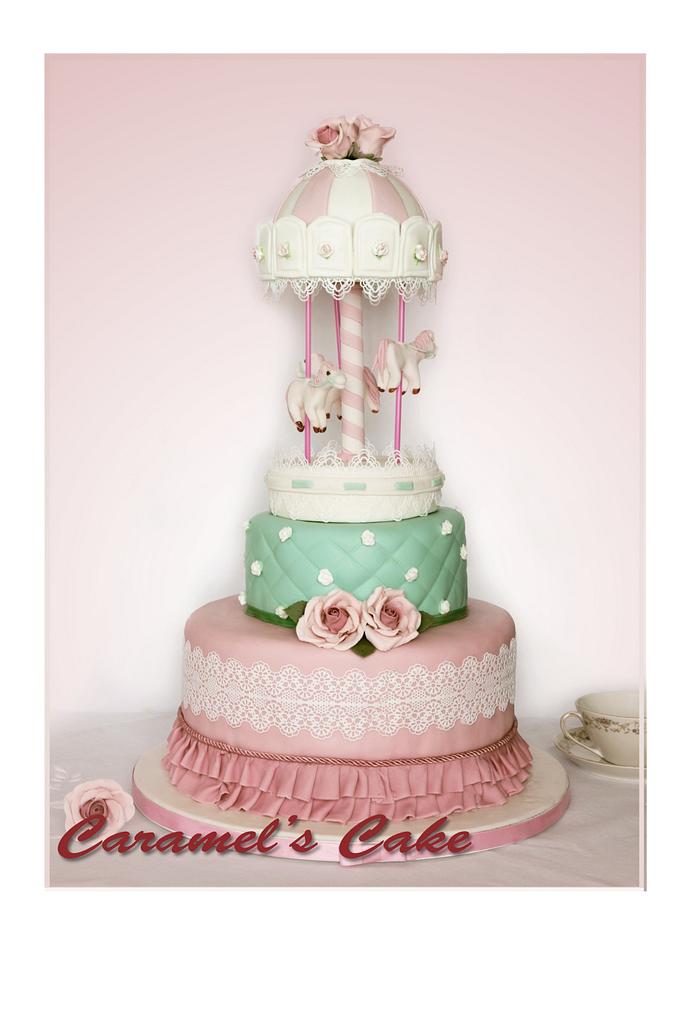 Carosel cake with roses and laces