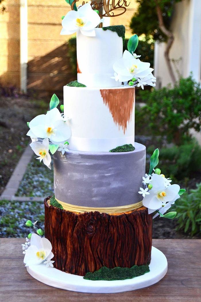 Orchid tree stump and moss wedding cake