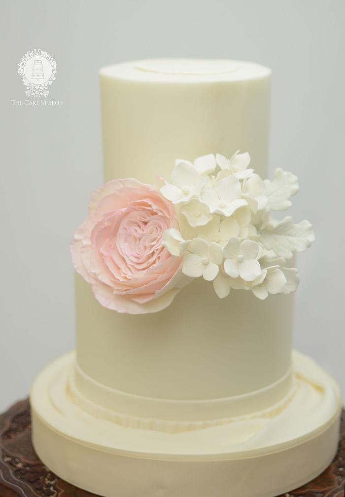 White Wedding Cake with Pink Flower