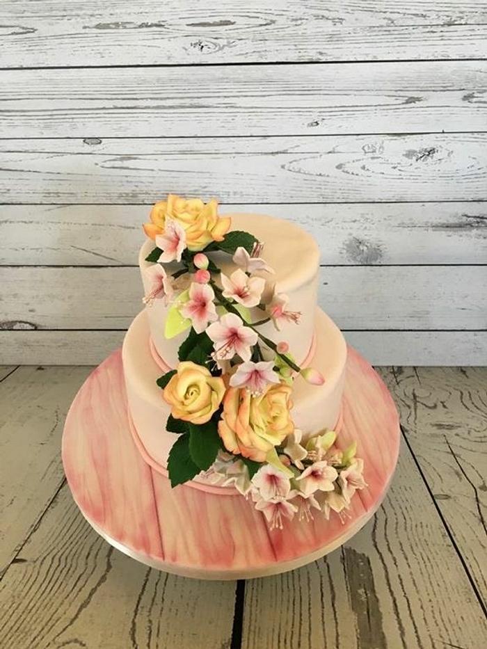 Wedding cake with sugar roses and cherry blossoms