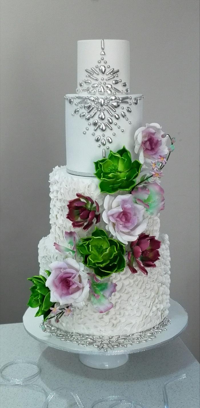 Wedding cake with succulents and roses