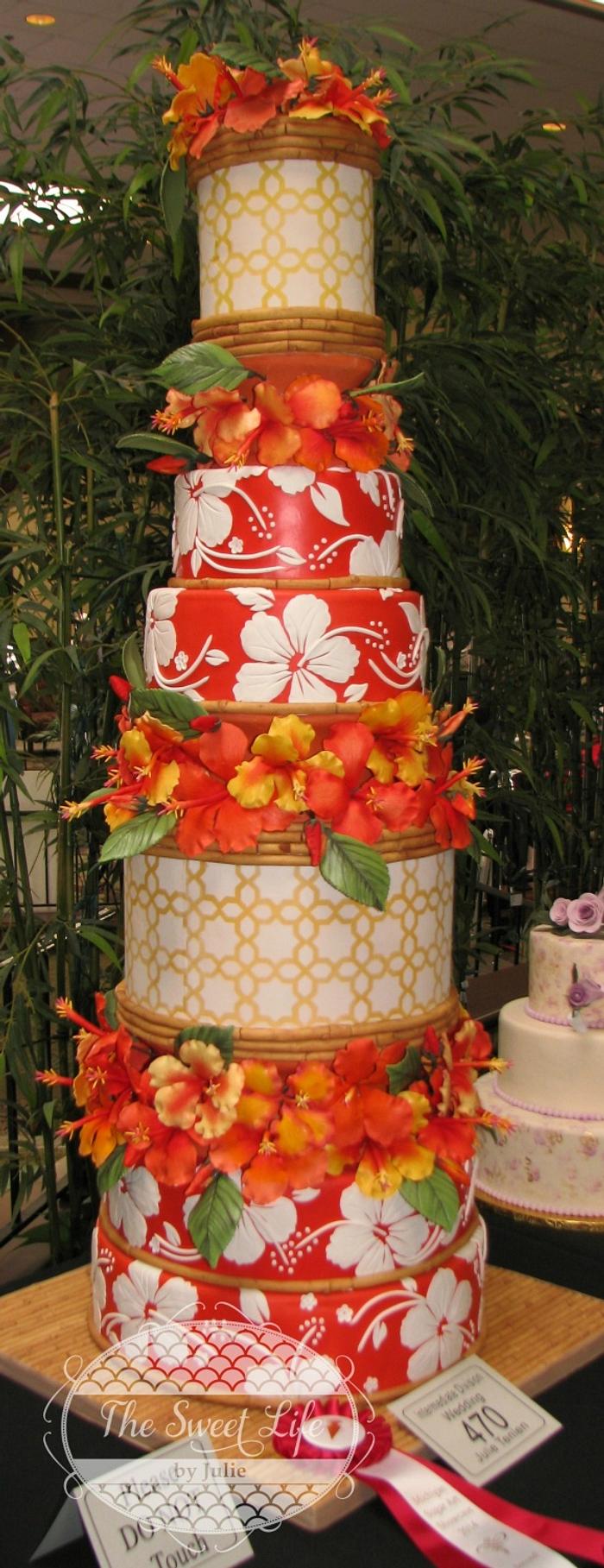 Hawaiian wedding cake featuring hibiscus flowers & bamboo