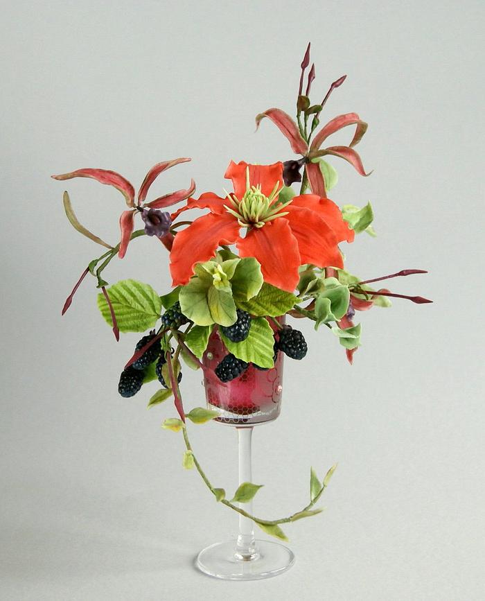 Arrangement of flowers with blacberry
