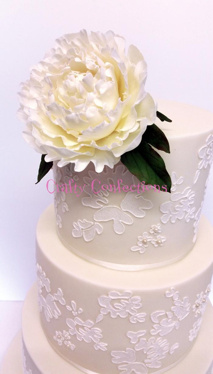 Piped lace and peony wedding cake