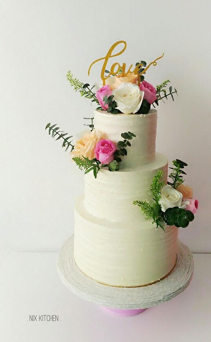 Rustic Buttercream Wedding Cake with fresh flowers