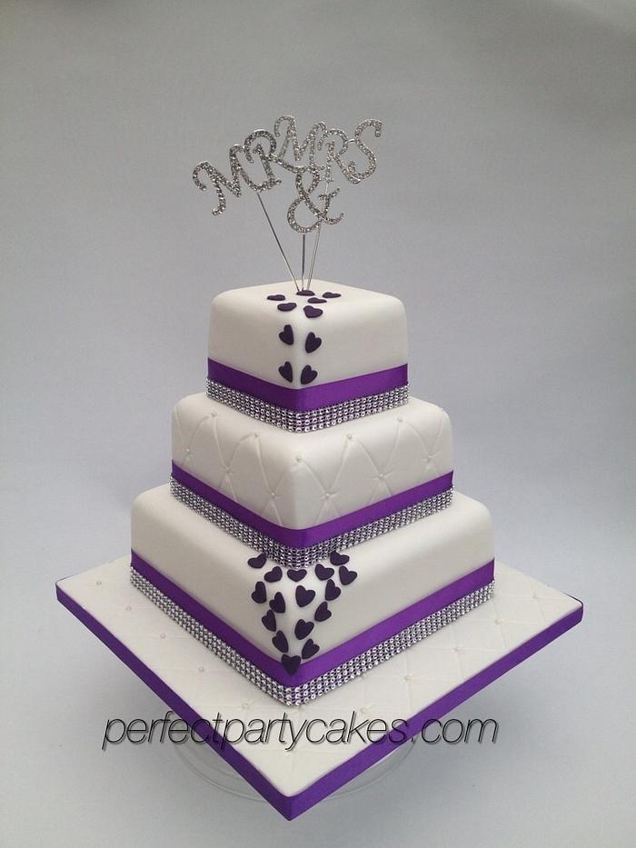Purple tiered wedding cake 