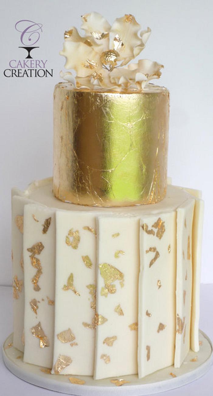 Gold leafing and white chocolate panels cake