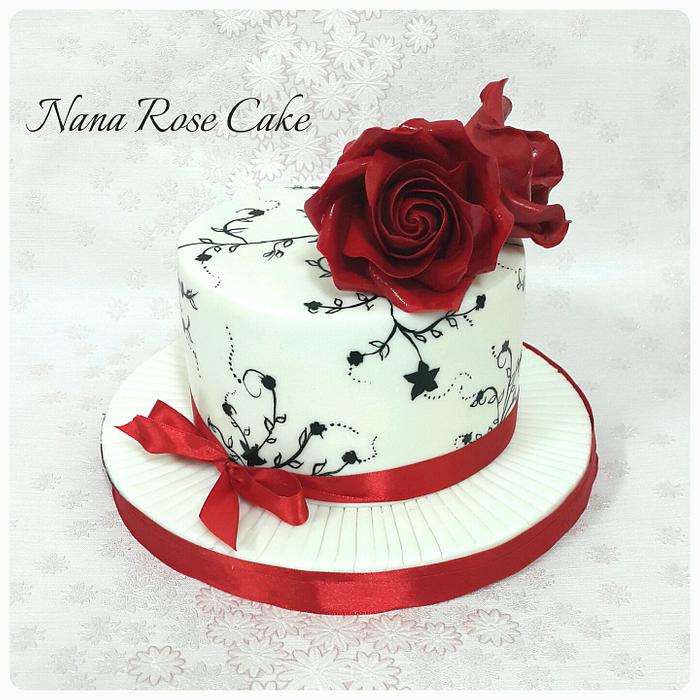38+ Beautiful Cake Designs To Swoon : Black Cake Topped with Red Roses