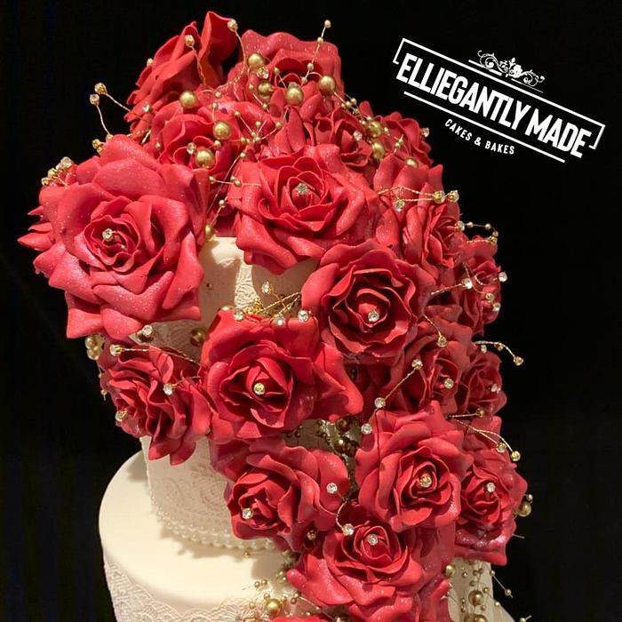 Lace wedding cake with handmade rose cascade