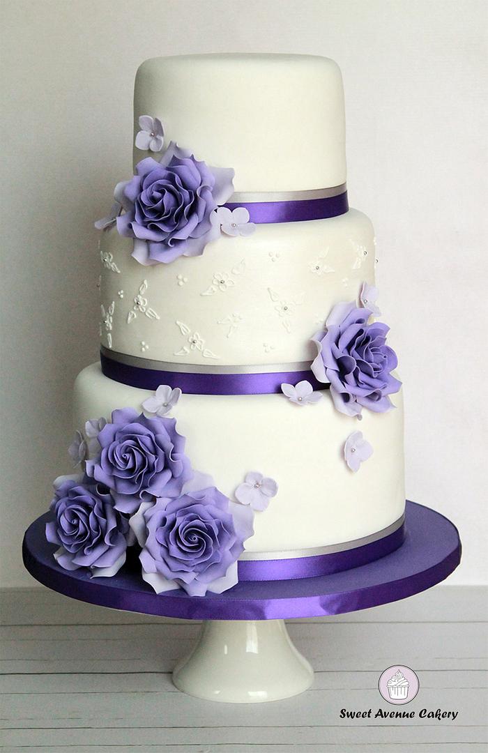 Elegant white and purple wedding cake