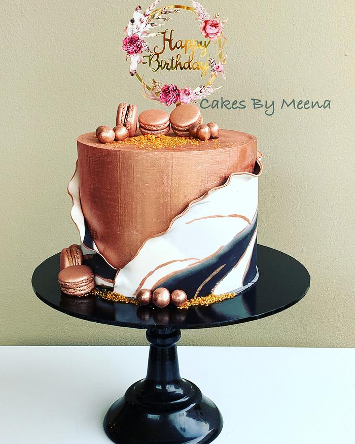 Rose gold black and white semi wrapped cake 