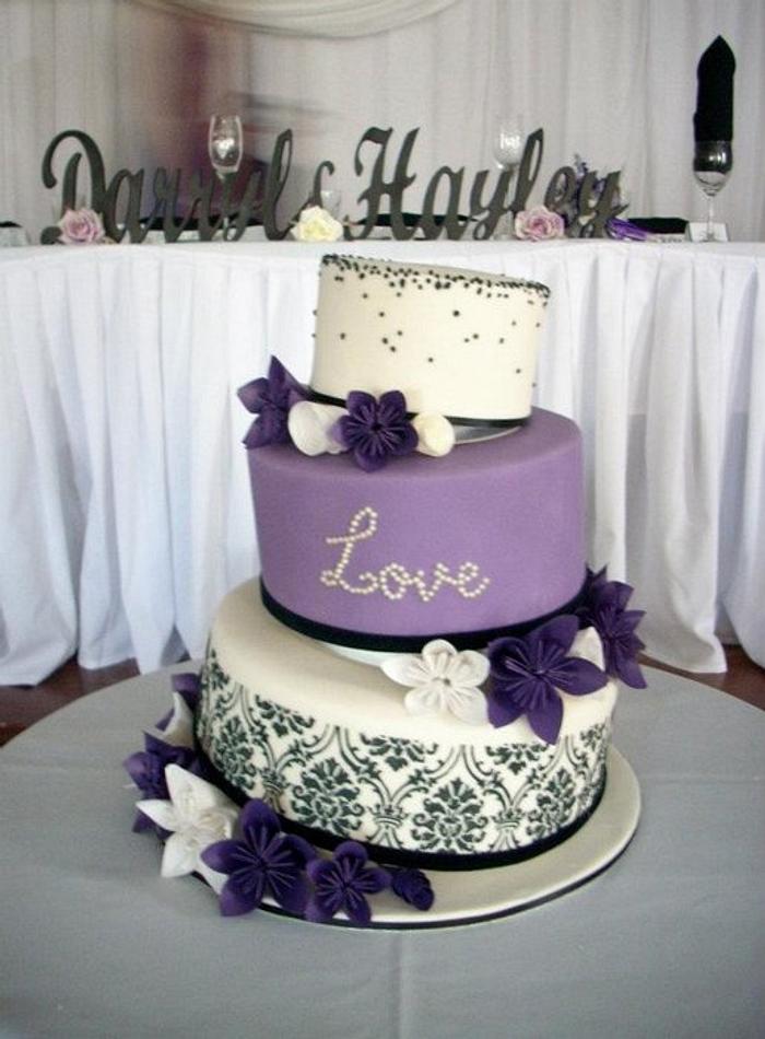 Purple and ivory wedding cake